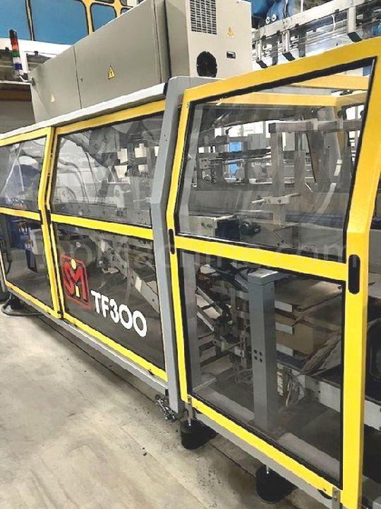 Used SMI TF300  ケーストレイパッカー